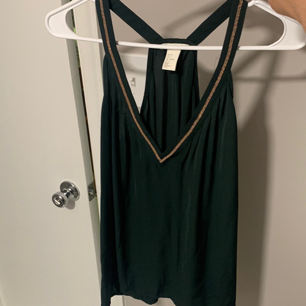 H&M green top with gold trim around the v-neck. Size 6.